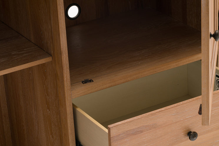 Wooden cabinet with a drawer and light fixture inside